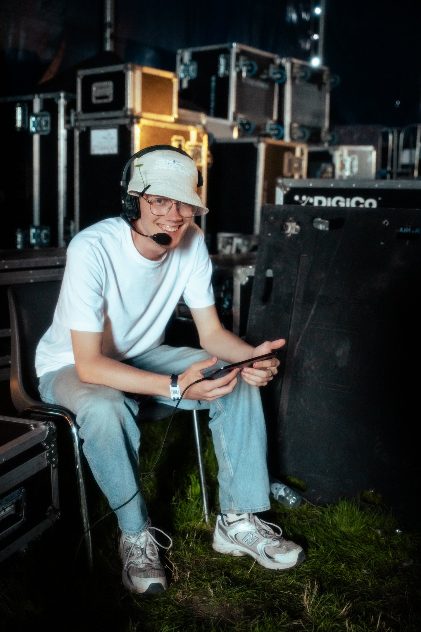 Crew member backstage at a festival production